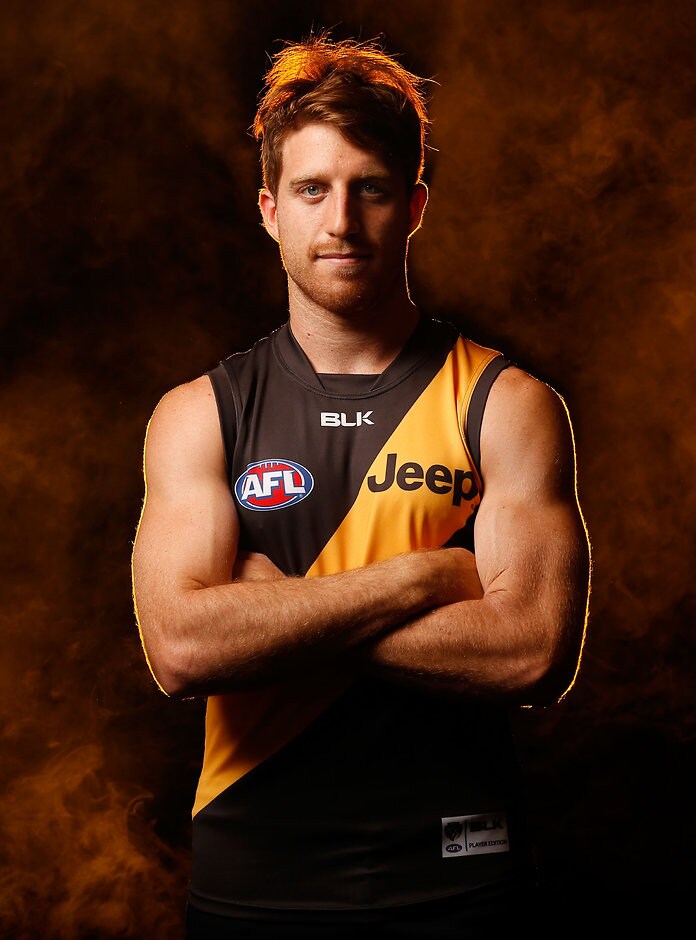 AFL 2016 Portraits - Richmond MELBOURNE, AUSTRALIA - MARCH 1: Reece Conca poses for a photograph during the Richmond Tigers 2016 official team photo day at Punt Road Oval in Melbourne on March 1, 2016. (Photo by Michael Willson/AFL Media)